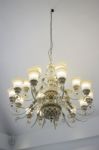 Vintage Chandelier Light Bulb In Dark Room Stock Photo