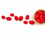 Fresh Grape Or Cherry Tomato In Wooden Bowl On White Background Stock Photo