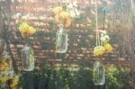 Flowers On Glass Bottles In The Garden Stock Photo