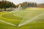 Watering In Golf Course Stock Photo