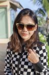 Portrait Of Beautiful Chick Fashion Woman Wearing Sun Glasses Against Afternoon Light With Blur Background And Copy Space Stock Photo