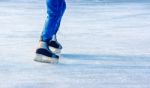 Young Man Is Skating. Feet Closeup Stock Photo