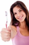 Beautiful Young Woman Holding Toothbrush And Smiling Stock Photo