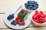 Green Tea Matcha Mousse Cake With Berries Stock Photo