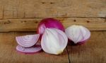 Red Onion On The Wooden Background Stock Photo