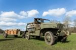 Military Army Jeep Pulling Trailer On Grass Stock Photo