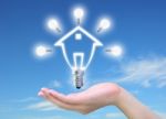 Light Bulb Model Of A House Stock Photo