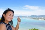 Woman Tourist Lifting Thumb Praise Beautiful Of Sea In Phuket, T Stock Photo