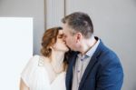 Couple Of Newlyweds Kiss Stock Photo