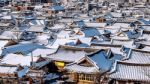 Roof Of Jeonju Traditional Korean Village Covered With Snow, Jeonju Hanok Village In Winter, South Korea Stock Photo