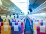 Blury Shot  Inside Wide Body  Airplane With Passenger Stock Photo