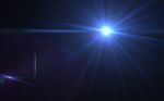 Abstract Lens Flare Light Over Black Background Stock Photo