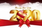 2020 Happy Newyear. Golden Letter Decorated With Ribbon Stock Photo