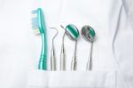 Dental Tools In Dentist Pocket Stock Photo