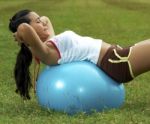 Doing Sit Ups With Exercise Ball Stock Photo