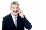 Happy Mature Man Talking On Cell Phone Stock Photo