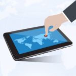 Tablet And Hand Connect To Globe Stock Photo