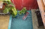 Rain Drop To The Swimming Pool Stock Photo