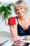Portrait Of A Relaxed Woman Holding Red Coffee Mug Stock Photo