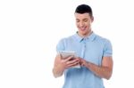 Young Man Using His Tablet Pc Stock Photo