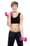 Cheerful Middle-aged Woman Woman Working Out Stock Photo