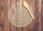Round Rope Napkin Or Stand And Spoon On A Wooden Rustic Table. T Stock Photo