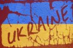 Ukraine Flag Painted On Old Concrete Wall With Ukraine Inscripti Stock Photo