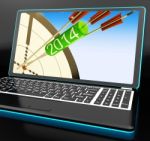 2014 Arrows On Laptop Showing Festivities Stock Photo