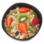 Muesli And Fruits In Bowl Isolated Stock Photo