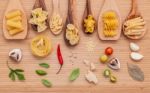 Italian Food Concept .various Kind Of Pasta In Wooden Spoons Wit Stock Photo