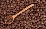 Sacha Inchi Peanut Seed With Wooden Spoon Stock Photo