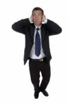 Full Pose Of Businessman Putting Hands On His Ears Stock Photo