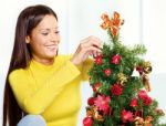 Woman Near Christmas Tree Stock Photo