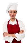 Pretty Chef Posing With Folded Arms Stock Photo