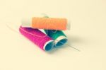 Sewing Threads And Needle Background Stock Photo