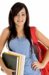Student Holding Bag And Books Stock Photo