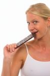 Woman Eating Chocolate Stock Photo