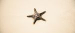 Starfish On The Beach Sand. Close Up Stock Photo