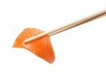 Chopsticks With Sliced Raw Salmon Stock Photo