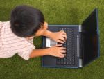Kid Using His Computer Stock Photo