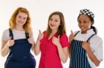 Three Happy College Career Female Students Give Thumbs-up Stock Photo