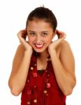 Girl Smiling Closing Ears Stock Photo