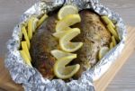 Baked Herring In Spices And Herbs In Foil Stock Photo