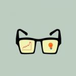 Graph Growth And Bulb On Glasses Stock Photo