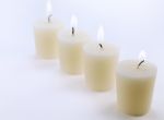 Four White Candles Stock Photo