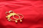 Gold Jewelry Ornament On Wide Red Floor Stock Photo