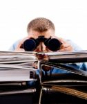 Young Professional In Office Looking Through Binocular Stock Photo