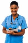 Female Physician Holding Tablet Pc Stock Photo