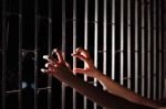 Hand Of Prisoner In Jail Stock Photo