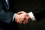 Business Handshake On Black Background Stock Photo